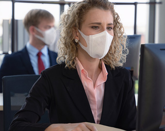 Worker wearing a mask at work